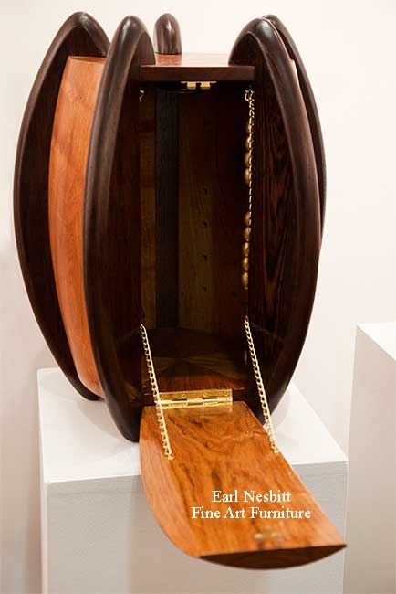 luxury jewelry box showing weighted chains supporting the drawbridge style door when opened